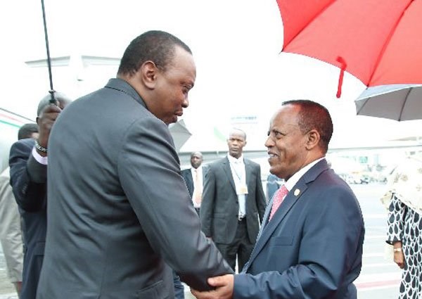 President Uhuru Kenyatta (left) arrives in Addis Ababa, Ethiopia, on August 5, 2016 to attend the 2nd IGAD PLUS Extraordinary Summit. Ethiopian authorities have given Kenya a one-week ultimatum to apprehend a culprit who killed an elder during a church mass at Todonyang, Turkana County. PHOTO | PSCU